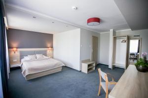 Postel nebo postele na pokoji v ubytování Elba Hotel