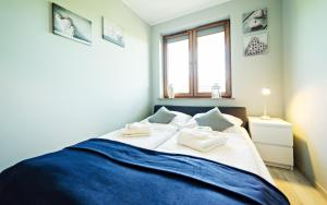 Postel nebo postele na pokoji v ubytování Ogrodnicza, Sun & Snow