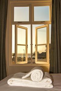 Ένα ή περισσότερα κρεβάτια σε δωμάτιο στο Casa al Mare Guest House