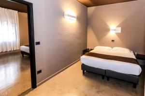 Postel nebo postele na pokoji v ubytování Hotel Mignon