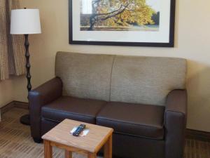 
a living room with a couch and a coffee table at Extended Stay America Suites - Wilkes-Barre - Hwy 315 in Wilkes-Barre
