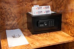 a microwave with a box on top of it at Hotel Gran Via in Logroño