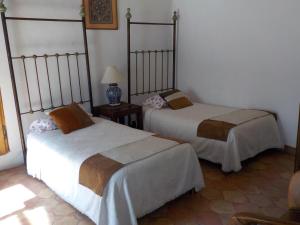 Cama o camas de una habitación en Hotel Shantiniketan