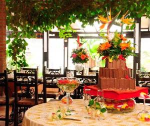 a table with a large cake on top of it at Hotel Mudejar in Cali