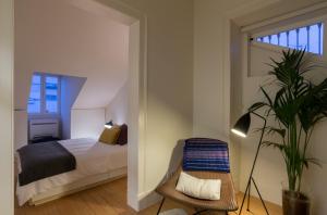 מיטה או מיטות בחדר ב-Lisbon 360