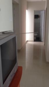 a television sitting on a table in a room at Departamentos Playa San Bartolo in San Bartolo