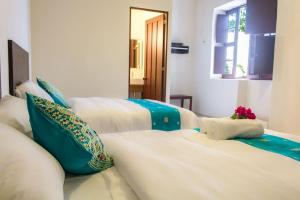 Letto o letti in una camera di Hotel Maculís