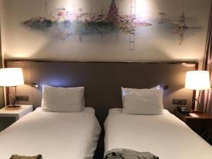 Postel nebo postele na pokoji v ubytování A1 Hotel Riga City Center