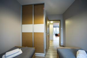 Posteľ alebo postele v izbe v ubytovaní APARTAMENTY GORZÓW WLKP. + 23 fotografií