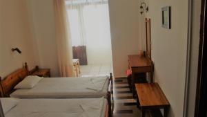 Posteľ alebo postele v izbe v ubytovaní Notis Hotel