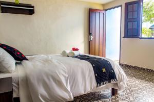 Letto o letti in una camera di Hotel Maculís