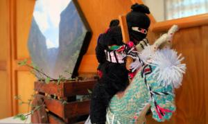 a stuffed animal is sitting next to a mirror at FolklorSuites in Tuxtla Gutiérrez