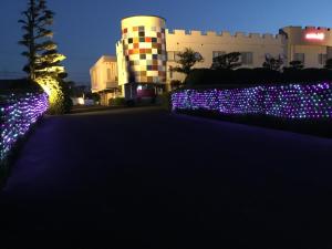 a driveway with christmas lights in front of a building at Hotel KBC (Love Hotel) in Saga