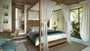 A bed or beds in a room at Azucar Hotel Tulum