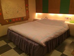 A bed or beds in a room at Fukui Aine (Adult Only)