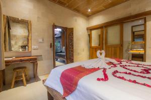 Postel nebo postele na pokoji v ubytování Pondok Prapen Guest House