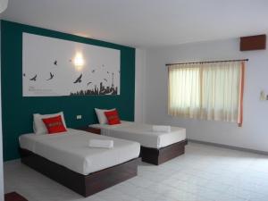 Forum House Hotel Krabi客房内的一张或多张床位