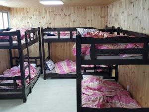 Postel nebo postele na pokoji v ubytování Guest House Manna
