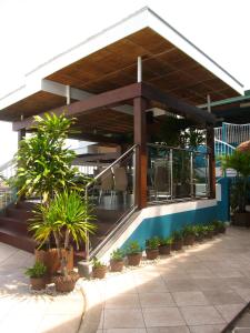 a building with potted plants in front of it at The Bellavista Hotel in Mactan