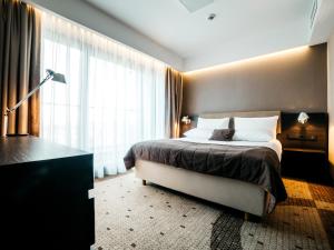 Posteľ alebo postele v izbe v ubytovaní Q Hotel Plus Kraków