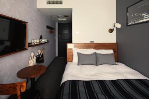 Postel nebo postele na pokoji v ubytování Hotel The Knot Yokohama
