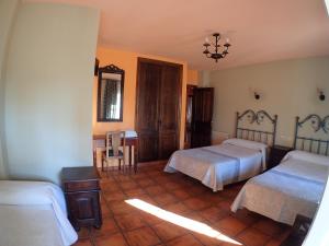 Postel nebo postele na pokoji v ubytování Hostal Santiago
