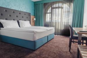 Postelja oz. postelje v sobi nastanitve Hotel Galatea
