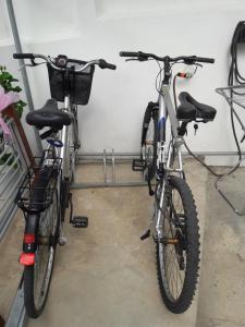 two bikes parked next to each other in a garage at Marina's Rooms in Larnaca