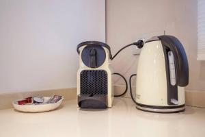 a toaster sitting on top of a kitchen counter at Hi Valencia Apartments - Jorge Juan in Valencia