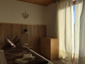 Łóżko lub łóżka w pokoju w obiekcie Pension & Apartments Waldkrieber
