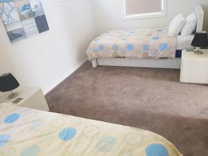 Ένα ή περισσότερα κρεβάτια σε δωμάτιο στο Wyndham Luxury - Free Wifi and Netflix