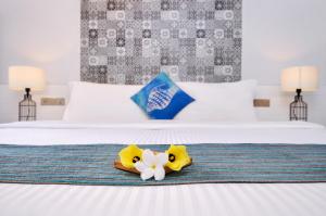 Voodi või voodid majutusasutuse Velana Beach Hotel Maldives toas