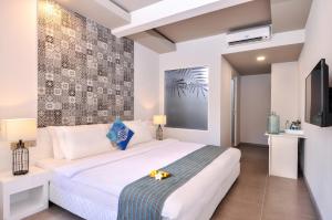 Voodi või voodid majutusasutuse Velana Beach Hotel Maldives toas