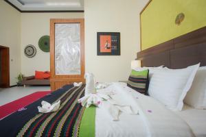 Cama o camas de una habitación en My Bagan Residence by Amata