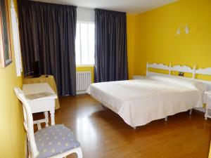 Postel nebo postele na pokoji v ubytování Hotel Millan + 30 fotografií