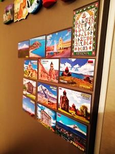 a refrigerator with a bunch of pictures on it at Hostel Sakharov & Tours in Yerevan