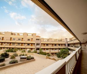 a view from the balcony of an apartment building at La Perla Médano 3 in El Médano