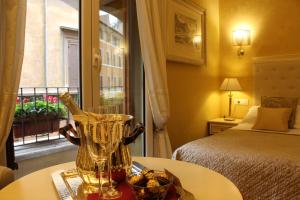 Postel nebo postele na pokoji v ubytování Locanda Navona