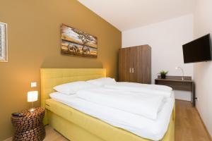 Łóżko lub łóżka w pokoju w obiekcie Vienna Stay Apartments Pezzl 1170