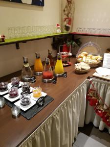 a table with different types of condiments on it at Hotel Herbst Berlin in Berlin