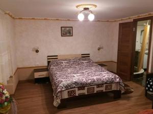 Posteľ alebo postele v izbe v ubytovaní Guest House Zhanna