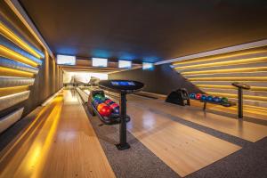 a bowling alley with pins and a bowling alley at Grand Lubicz Uzdrowisko Ustka in Ustka