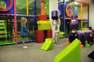 two children playing in an indoor playground at Grand Lubicz Uzdrowisko Ustka in Ustka