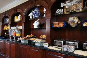 a kitchen with a counter with bread and other foods at Inn at Pelican Bay in Naples
