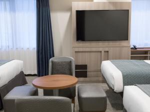 TV a/nebo společenská místnost v ubytování HOTEL MYSTAYS Midosuji Honmachi