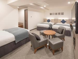 Ein Bett oder Betten in einem Zimmer der Unterkunft HOTEL MYSTAYS Midosuji Honmachi