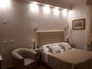 Postel nebo postele na pokoji v ubytování Locanda Navona