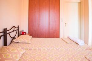 Postel nebo postele na pokoji v ubytování Manesi Apartments