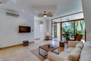 a living room with a couch and a table at Brisas del Monte #3 in Guanacaste