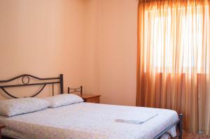 Postel nebo postele na pokoji v ubytování Manesi Apartments